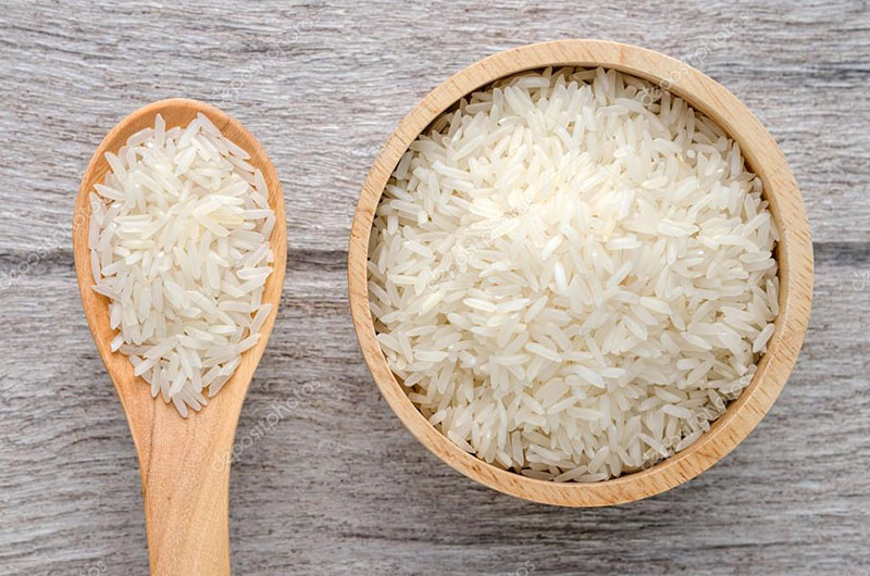 depositphotos 85094304 stock photo uncooked rice in bowl on - برنج کشت دوم؛ تفاوت کشت اول و دوم چیست؟